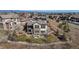 Aerial view of a home showcasing its well-maintained lawn, patio, and charming community at 1240 Starglow Pl, Highlands Ranch, CO 80126