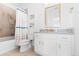 Clean bathroom features vanity with modern faucet, and tiled shower/tub combo at 1240 Starglow Pl, Highlands Ranch, CO 80126