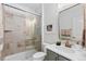 Modern bathroom featuring glass shower, sleek vanity, and stylish tile work at 1240 Starglow Pl, Highlands Ranch, CO 80126