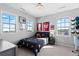 Well lit bedroom features multiple windows and sporty decor at 1240 Starglow Pl, Highlands Ranch, CO 80126