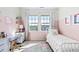 Charming bedroom with decorative rug and a view at 1240 Starglow Pl, Highlands Ranch, CO 80126