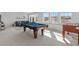 Game room featuring a billiards table, and foosball table, and views from multiple windows at 1240 Starglow Pl, Highlands Ranch, CO 80126