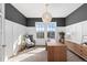 Bright home office with designer lighting, modern decor, hardwood floors and a view of the outdoors at 1240 Starglow Pl, Highlands Ranch, CO 80126