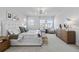 Spacious main bedroom with furniture, natural light and carpeted floor at 1240 Starglow Pl, Highlands Ranch, CO 80126