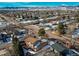 A high aerial view shows the home near an intersection with the mountains in the background at 5894 S Oak St, Littleton, CO 80127