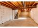 Unfinished basement with exposed beams and stairs, ready for customization at 5894 S Oak St, Littleton, CO 80127