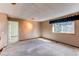Spacious bedroom with a window letting in natural light, awaiting your personal touch at 5894 S Oak St, Littleton, CO 80127
