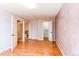 A view of the bedroom showing multiple doorways leading to other rooms in the house at 5894 S Oak St, Littleton, CO 80127