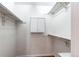A well-organized walk-in closet with white shelving and a central storage cabinet at 5894 S Oak St, Littleton, CO 80127