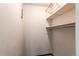 Empty closet with shelves and a rod, offering ample storage space at 5894 S Oak St, Littleton, CO 80127
