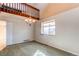 Bright dining room with natural light, a modern chandelier, and access to the upper floor at 5894 S Oak St, Littleton, CO 80127