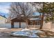 Charming home featuring a two-car garage and a well-maintained front yard at 5894 S Oak St, Littleton, CO 80127