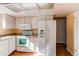 Bright kitchen featuring a microwave, an oven, and a refrigerator at 5894 S Oak St, Littleton, CO 80127
