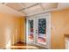 Bright kitchen featuring hardwood floors and doors that lead to the deck at 5894 S Oak St, Littleton, CO 80127