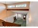 A unique living room with a brick fireplace, beam, large window and high ceilings at 5894 S Oak St, Littleton, CO 80127