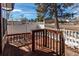 Welcoming porch featuring wood railings and steps, offering a cozy outdoor space at 5894 S Oak St, Littleton, CO 80127