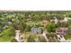 Sweeping aerial shot of a well-maintained home and surrounding properties with mature trees and manicured lawns at 7398 E Windlawn Way, Parker, CO 80134
