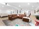 Finished basement featuring a cozy sitting area with a leather sectional and recessed lighting at 7398 E Windlawn Way, Parker, CO 80134