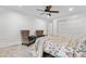 Cozy bedroom featuring a ceiling fan, sitting chairs, and neutral carpet at 7398 E Windlawn Way, Parker, CO 80134