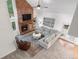 Aerial view of a bright living room featuring a fireplace, stylish furniture, and an open layout at 7398 E Windlawn Way, Parker, CO 80134