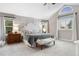 Spacious main bedroom boasts a vaulted ceiling, two windows, and elegant wall paneling, creating a serene retreat at 7398 E Windlawn Way, Parker, CO 80134
