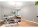Inviting office with great natural light, hardwood floors, and a stylish desk area at 7398 E Windlawn Way, Parker, CO 80134