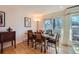 Inviting dining room boasts hardwood floors, seating for six, and natural light through sliding glass doors at 1513 48Th St # 7, Boulder, CO 80303