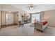 Inviting living room featuring a cozy fireplace, sliding glass doors, and neutral decor at 8424 Everett Way # A, Arvada, CO 80005