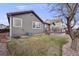 Backyard featuring a lush lawn, wooden deck, and mature tree, perfect for outdoor relaxation at 17138 Moorside Dr, Parker, CO 80134