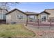 Backyard featuring a manicured lawn and a wooden deck, ideal for outdoor gatherings and relaxation at 17138 Moorside Dr, Parker, CO 80134