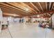 Unfinished basement with exposed ceiling and concrete floor, providing ample space for customization and storage at 17138 Moorside Dr, Parker, CO 80134