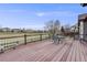 Wooden deck with seating and views of the green space, perfect for outdoor entertaining and enjoying nature at 17138 Moorside Dr, Parker, CO 80134