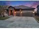 Charming home featuring a three-car garage, brick accents, and an inviting entrance at 17138 Moorside Dr, Parker, CO 80134