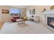 A spacious living room features carpet, a large window, and a fireplace at 17138 Moorside Dr, Parker, CO 80134