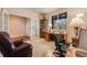 Spacious office with French doors, a bright window, a built-in bookcase, and a comfortable leather chair at 17138 Moorside Dr, Parker, CO 80134