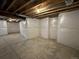 Unfinished basement with insulated walls and concrete floor at 6060 N Perth St, Aurora, CO 80019