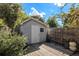 Backyard shed features a wooden deck and yard at 7622 E Nassau Ave, Denver, CO 80237