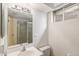 Bright basement bathroom with shower and vanity at 7622 E Nassau Ave, Denver, CO 80237