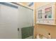 Bathroom showcases a white shower and wall storage at 7622 E Nassau Ave, Denver, CO 80237