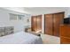 Spacious bedroom featuring ample natural light and large closets at 7622 E Nassau Ave, Denver, CO 80237