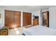 Bright bedroom with carpeting and large closet at 7622 E Nassau Ave, Denver, CO 80237
