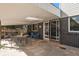 Covered patio, ideal for outdoor dining and entertaining at 7622 E Nassau Ave, Denver, CO 80237