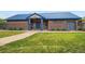 Carroll Butts Aquatics Center with brick facade, blue roof and gated entrance at 3180 Mowry Pl, Westminster, CO 80031