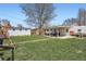 Expansive backyard featuring a well-maintained lawn, patio, storage shed and play area at 3180 Mowry Pl, Westminster, CO 80031