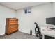 This basement features a wood dresser, a small window and a desk at 3180 Mowry Pl, Westminster, CO 80031
