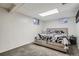 This basement bedroom has a neutral color scheme with a decorative patterned floor at 3180 Mowry Pl, Westminster, CO 80031