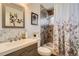This bathroom features an updated vanity, tile shower, and modern accents at 3180 Mowry Pl, Westminster, CO 80031
