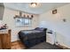 This bedroom features hardwood floors, one window, and eclectic decor at 3180 Mowry Pl, Westminster, CO 80031
