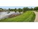 Scenic pond with a well-maintained green space at 3180 Mowry Pl, Westminster, CO 80031