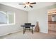 Cozy bedroom with ample natural light and adjacent bathroom access at 10222 Gemstone Ct, Parker, CO 80134